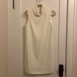 White dress, worn once for rehearsal dinner. Small stained noted on back